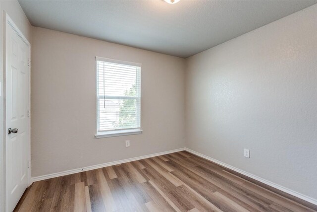 8236 Brucks Dr, San Antonio, TX 78244 - unfurnished room featuring wood finished floors and baseboards