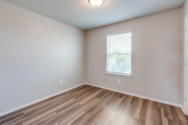 8236 Brucks Dr, San Antonio, TX 78244 - unfurnished room with wood finished floors
