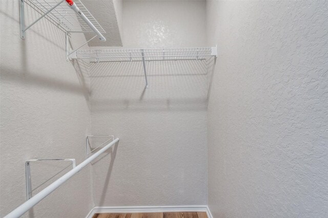 8236 Brucks Dr, San Antonio, TX 78244 - walk in closet with wood finished floors