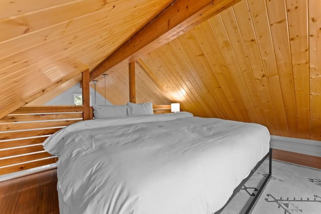 bedroom featuring lofted ceiling with beams, wood ceiling, and wood-type flooring