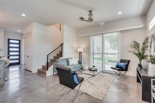 living area with stairs, concrete floors, baseboards, and recessed lighting