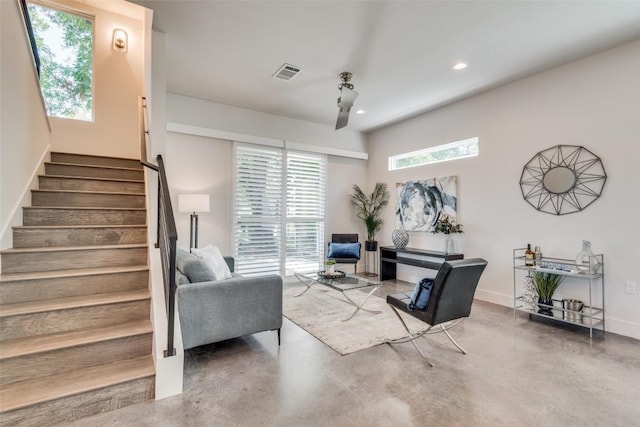 living room with recessed lighting, visible vents, stairway, concrete floors, and baseboards