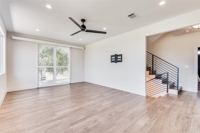 6217 Clovis St Unit A, Austin, TX 78741 - spare room with ceiling fan, stairs, wood finished floors, recessed lighting, and baseboards