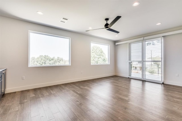 6217 Clovis St Unit A, Austin, TX 78741 - spare room featuring ceiling fan, baseboards, dark wood finished floors, and recessed lighting