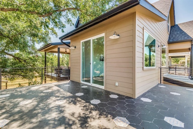 6217 Clovis St Unit A, Austin, TX 78741 - view of side of property with roof with shingles and a patio area