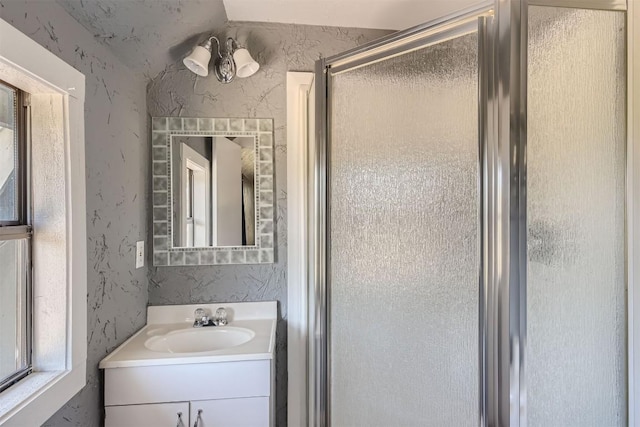 bathroom featuring vanity and walk in shower