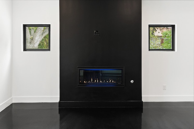 1312 W Clark St, Bartlett, TX 76511 - detailed view of a fireplace and baseboards