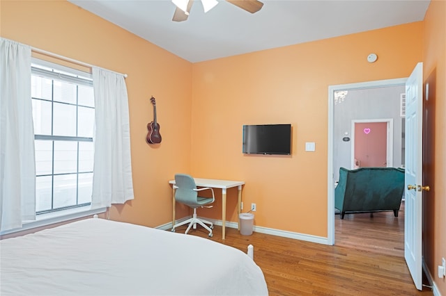 bedroom featuring ceiling fan and wood-type flooring