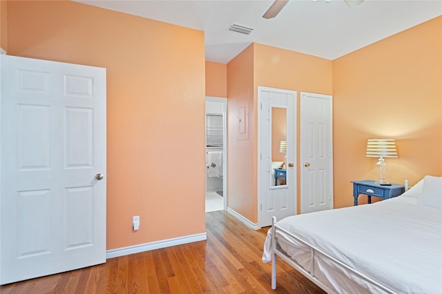 bedroom with ceiling fan and light wood-type flooring