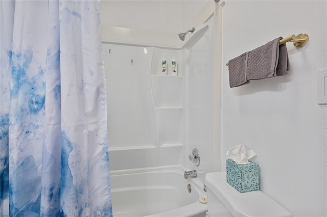 bathroom with toilet and shower / tub combo with curtain