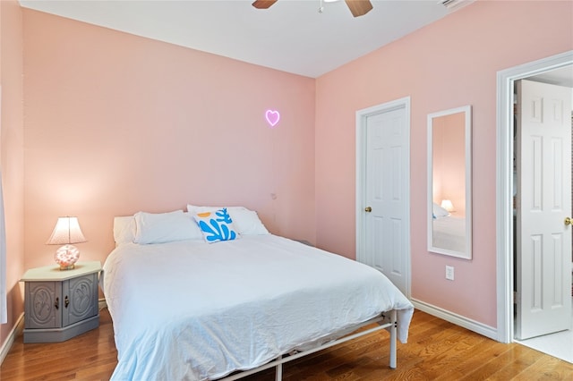 bedroom featuring ceiling fan and wood-type flooring