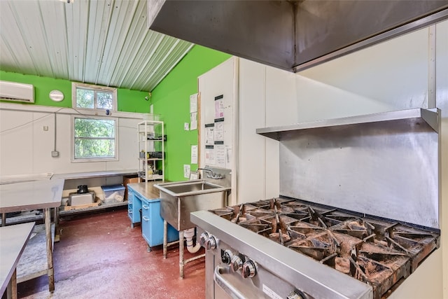 kitchen featuring lofted ceiling and a wall mounted AC