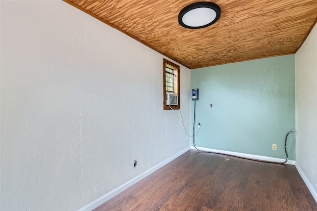 unfurnished room featuring wooden ceiling, cooling unit, and hardwood / wood-style flooring