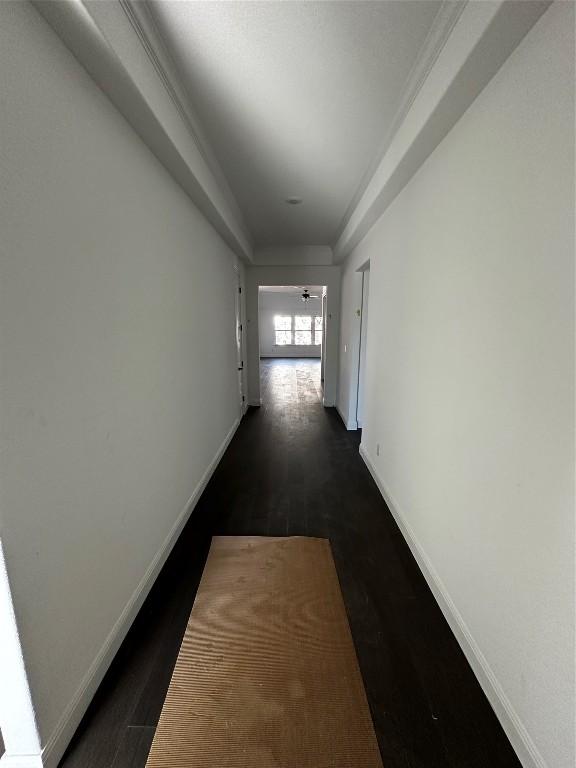 hallway with dark hardwood / wood-style flooring