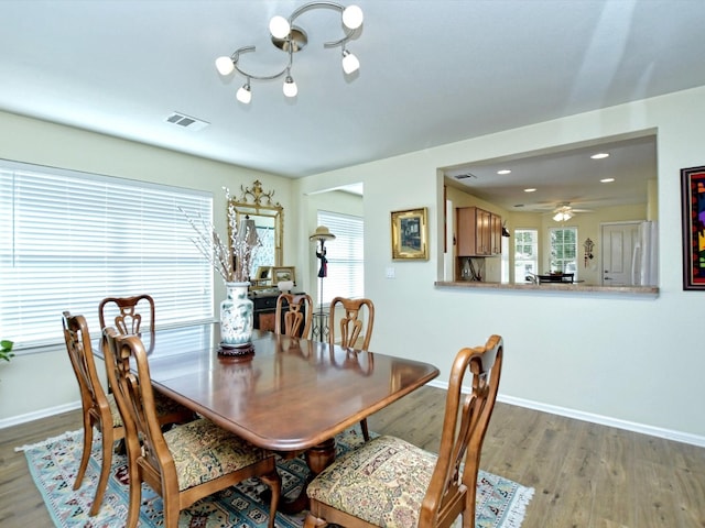 dining room featuring hardwood / wood-style flooring and ceiling fan