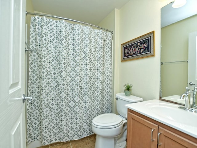 bathroom featuring vanity, toilet, tile patterned floors, and curtained shower