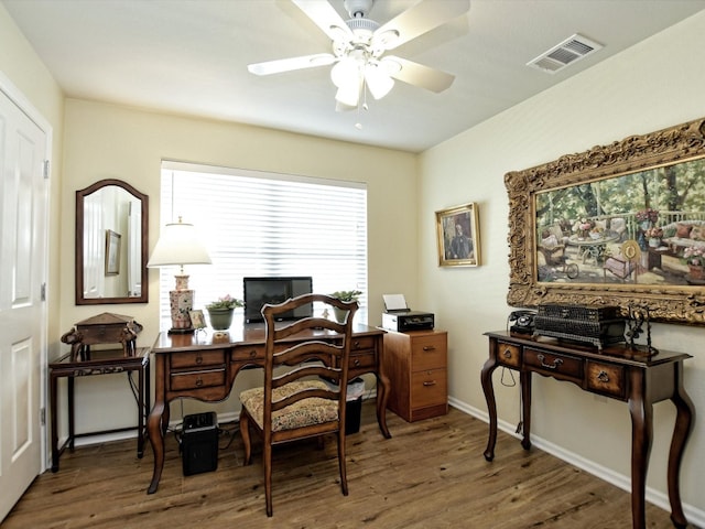 office area with ceiling fan and dark hardwood / wood-style flooring