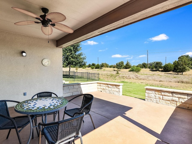 view of patio featuring a rural view and ceiling fan