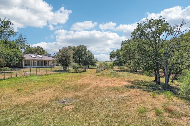 view of yard with a rural view