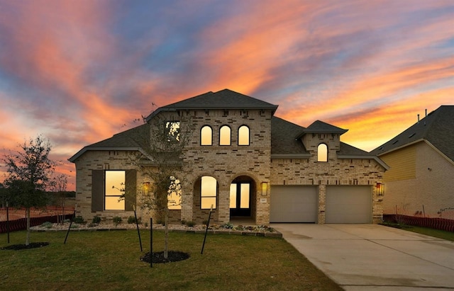 french country inspired facade featuring a lawn