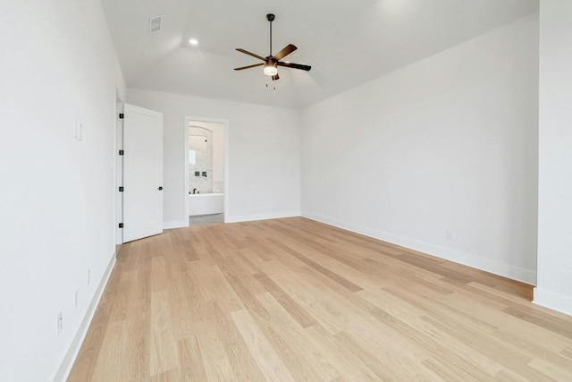 empty room with light hardwood / wood-style floors, ceiling fan, and lofted ceiling