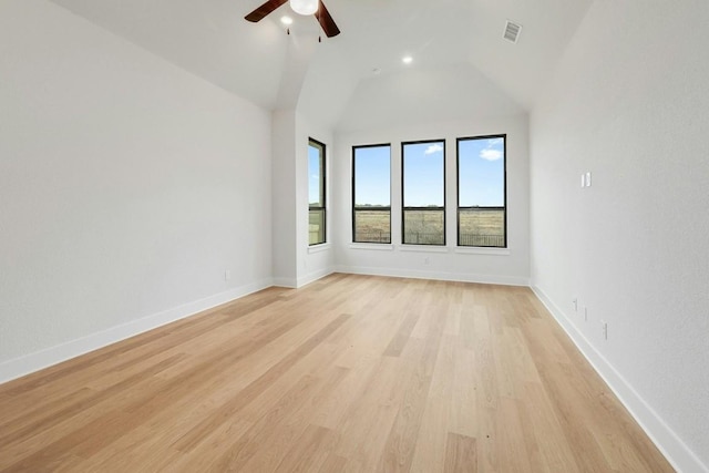 unfurnished room with light hardwood / wood-style flooring, vaulted ceiling, and ceiling fan