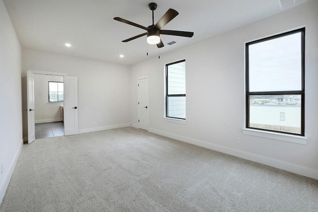 carpeted empty room with ceiling fan