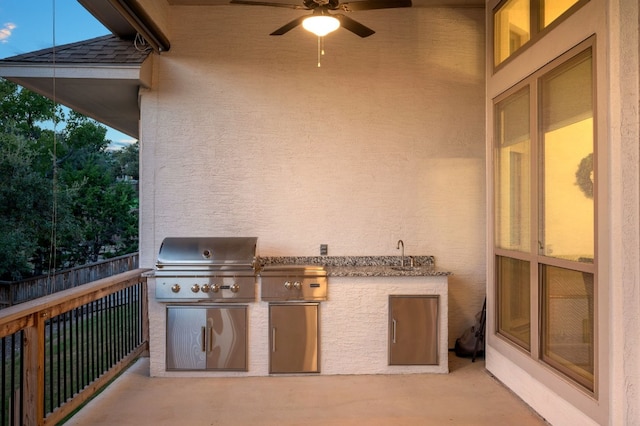 view of patio / terrace featuring sink, ceiling fan, and area for grilling