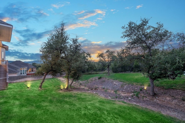 view of yard at dusk