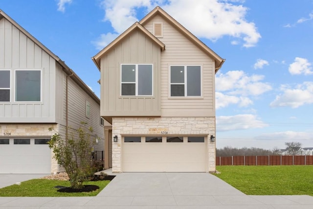 view of front of property with a garage and a front lawn