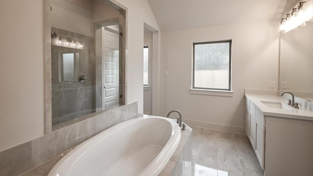 bathroom featuring separate shower and tub, vanity, and lofted ceiling