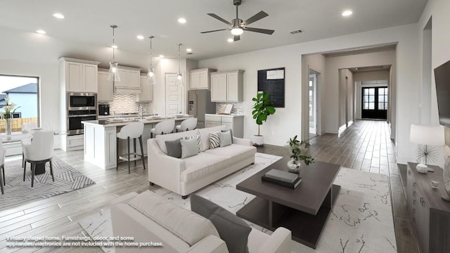 living room featuring ceiling fan