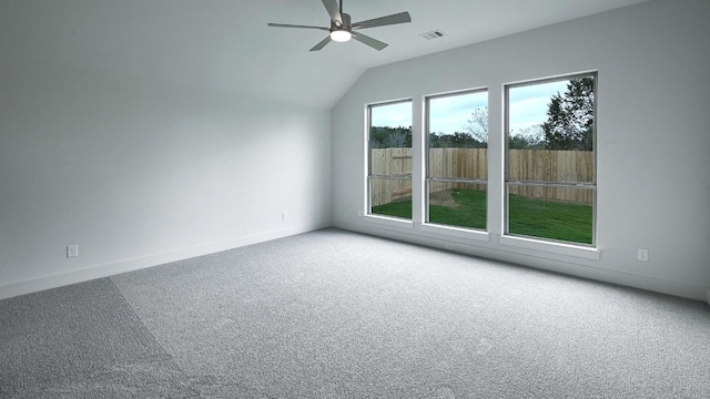 unfurnished room featuring carpet flooring, ceiling fan, and lofted ceiling