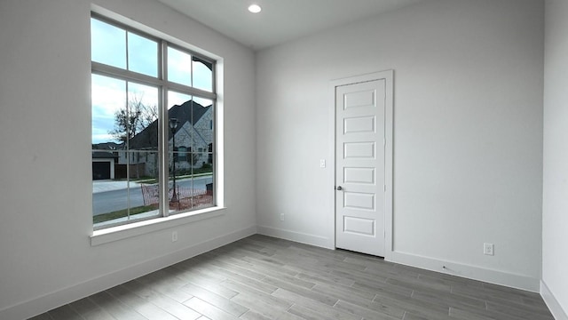 spare room with hardwood / wood-style floors