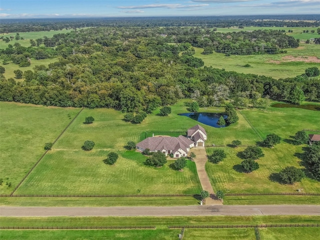 aerial view with a rural view and a water view