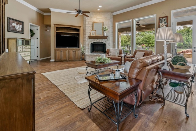 living room with crown molding, hardwood / wood-style floors, and plenty of natural light