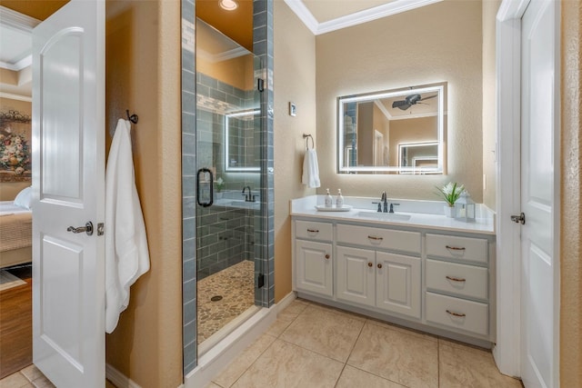 bathroom featuring vanity, ornamental molding, tile patterned flooring, and a shower with door