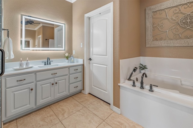 bathroom with vanity, tile patterned floors, a bathtub, and ceiling fan