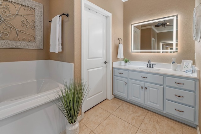 bathroom with vanity, tile patterned flooring, a bath, and ceiling fan