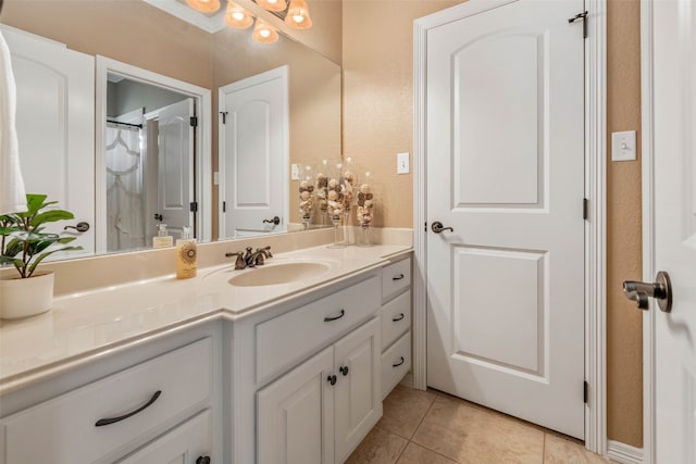 bathroom featuring vanity and tile patterned flooring