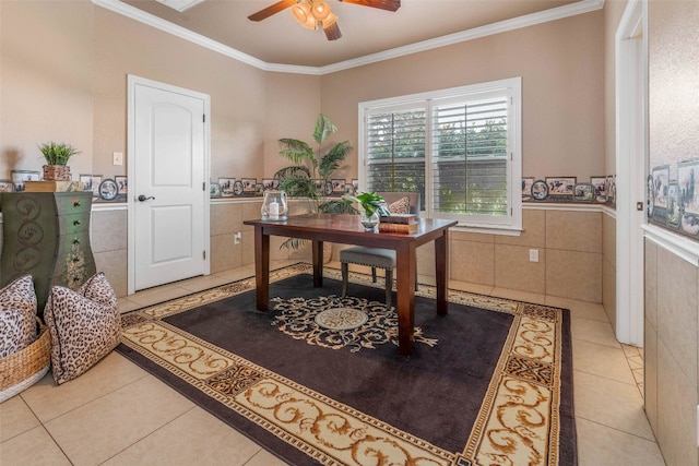 home office featuring ceiling fan, ornamental molding, light tile patterned flooring, and tile walls