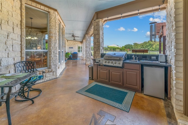 view of patio with area for grilling, sink, an outdoor kitchen, and ceiling fan