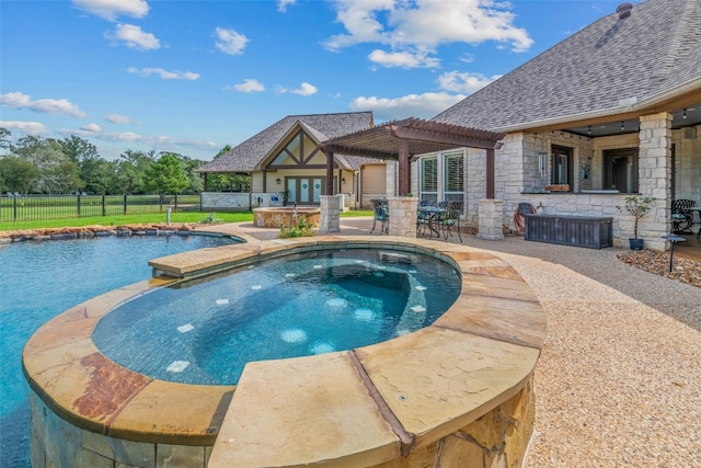 view of pool featuring a patio area, an in ground hot tub, and a pergola