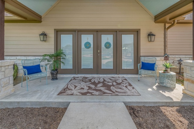 doorway to property with a patio area and french doors