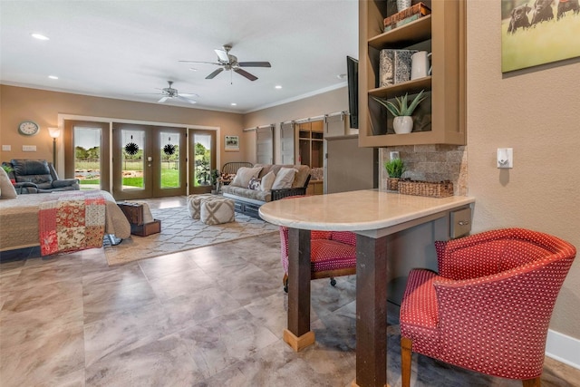 interior space with french doors, ornamental molding, and ceiling fan