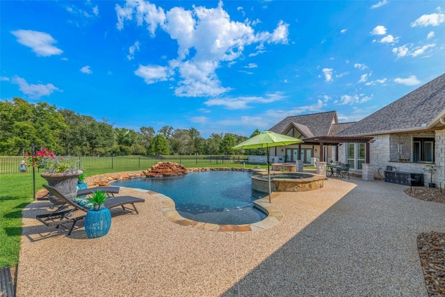 view of swimming pool with an in ground hot tub, a yard, and a patio