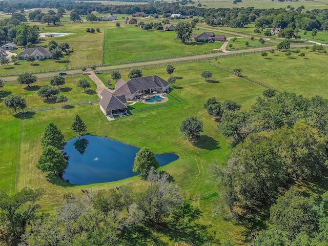 drone / aerial view with a rural view and a water view