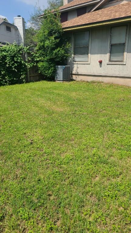 view of yard with central AC unit