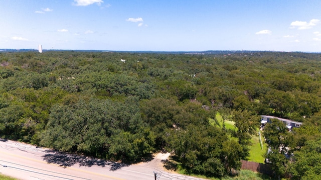 drone / aerial view featuring a forest view