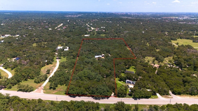 aerial view featuring a view of trees